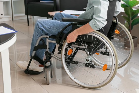 man in wheelchair - catheterization for spinal cord injuries