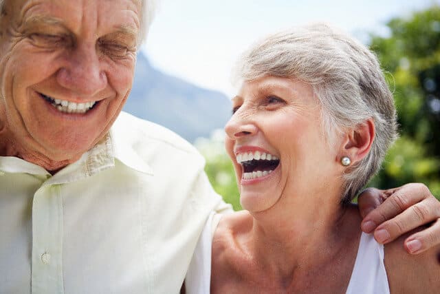 elderly couple laughing