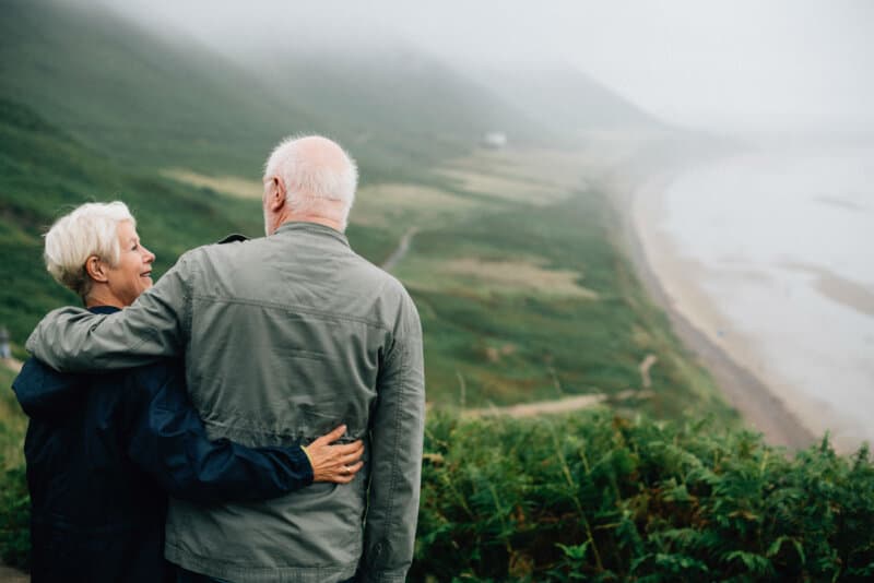 elderly couple on a cliff walk
